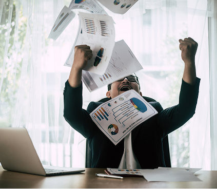 Person celebrating with papers